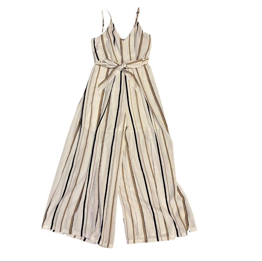 A flared neutral toned jumpsuit